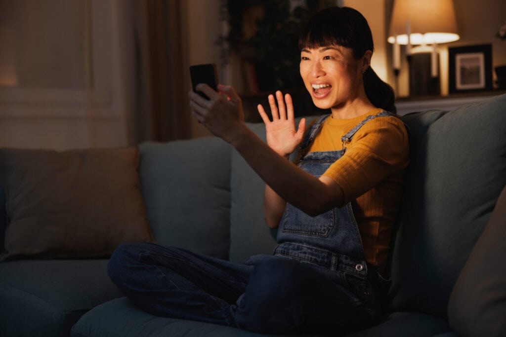Woman having video call using smart phone